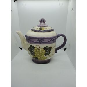 This is a Merlot Teapot Hand painted by Tabletops Unlimited